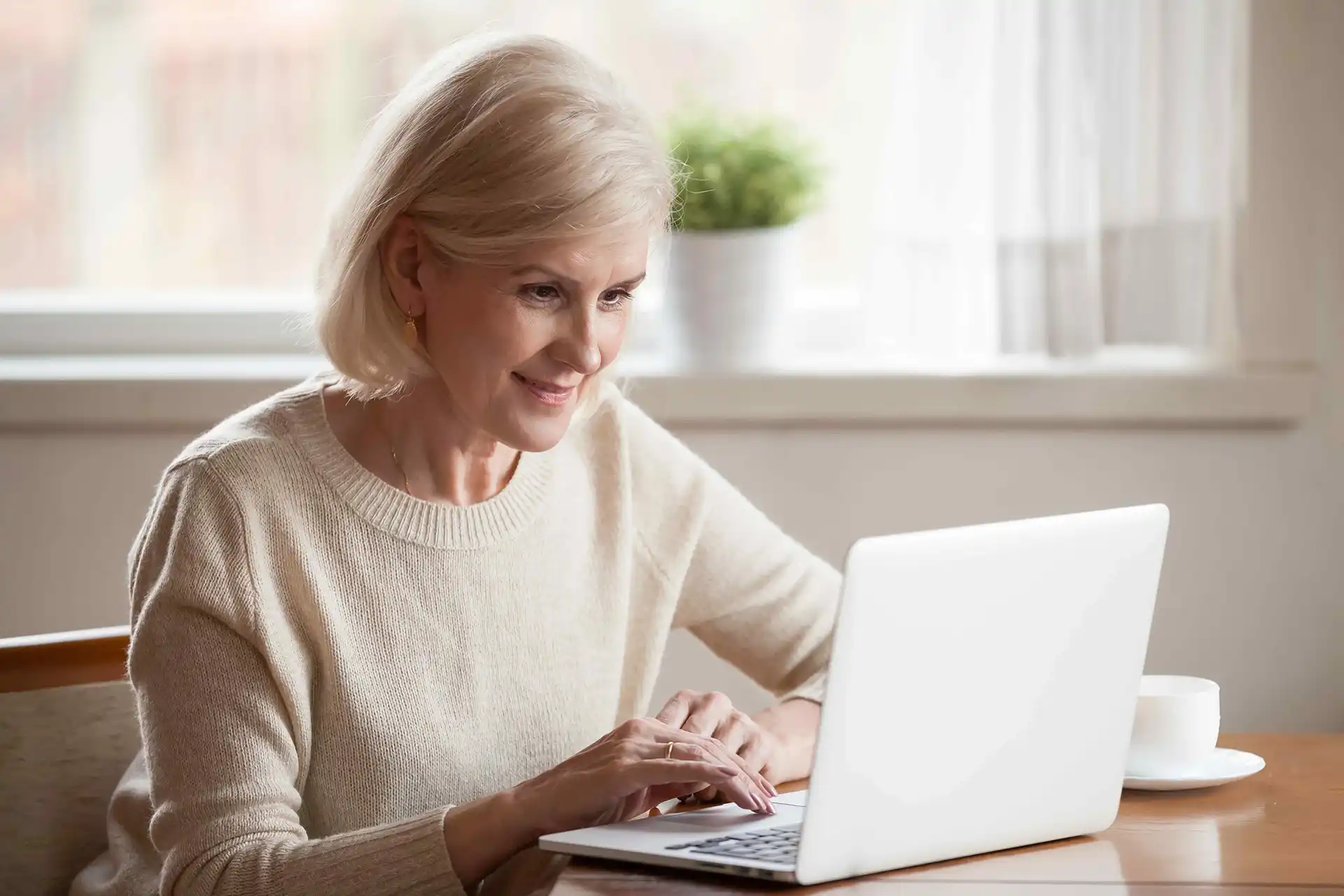 A woman works at her computer