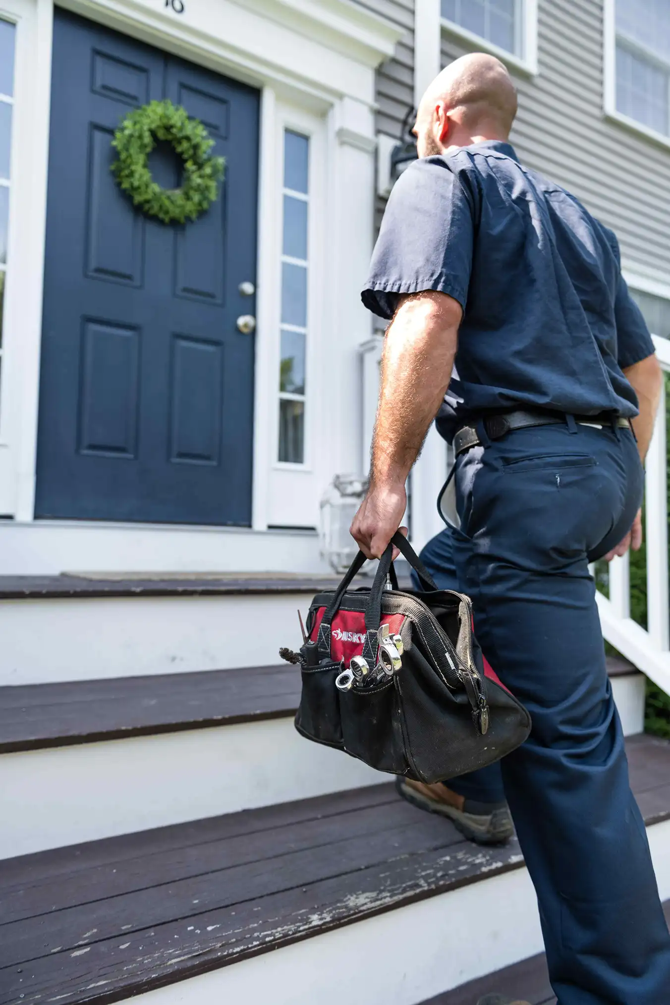 Dead River Company approaching home door for inspection